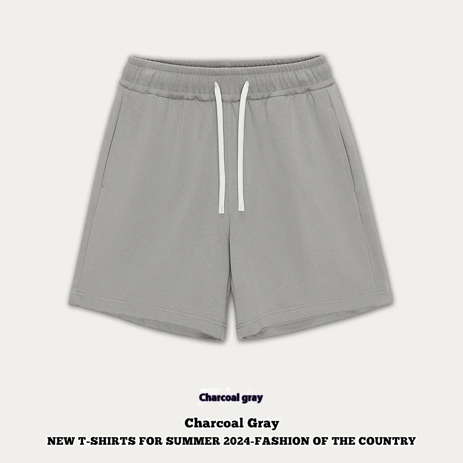 Child wearing loose fit cotton denim shorts in charcoal grey, showing casual summer style