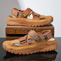 Men's grey casual sandals with a mesh lining, genuine leather upper, and an elastic band toe holder on a rubber sole.