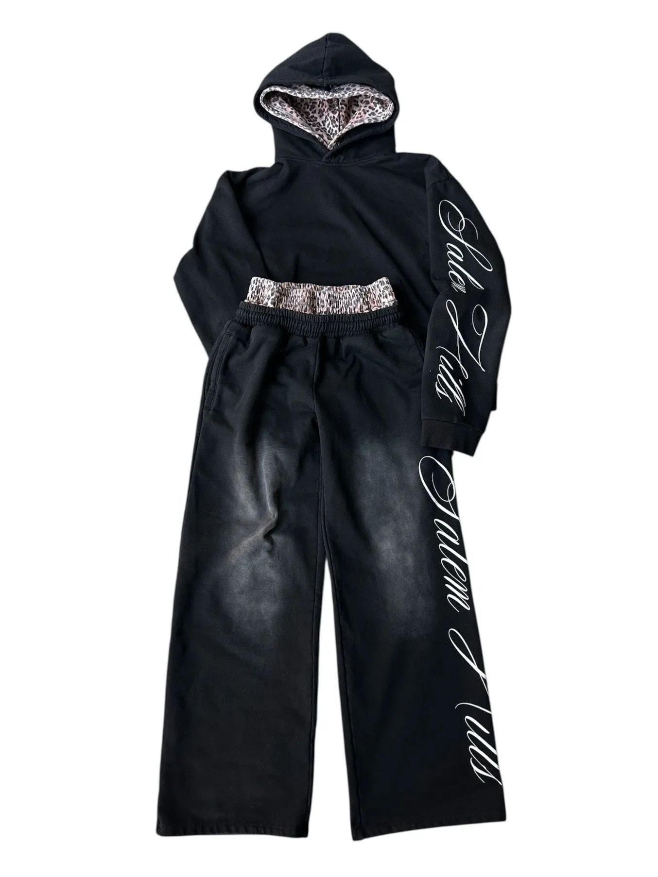 Adult male punk print hoodie and pants leisure suit set in fleece-lined polyester.