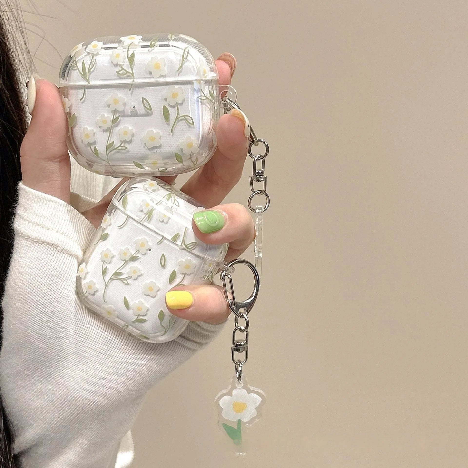 White floral high-transparency TPU protective cover for Apple AirPods showing decorative patterns