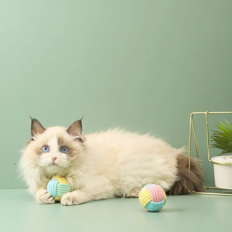 Handmade soft cotton plush ball cat toy in blue powder, green blue, or pink green colours, 5cm diameter