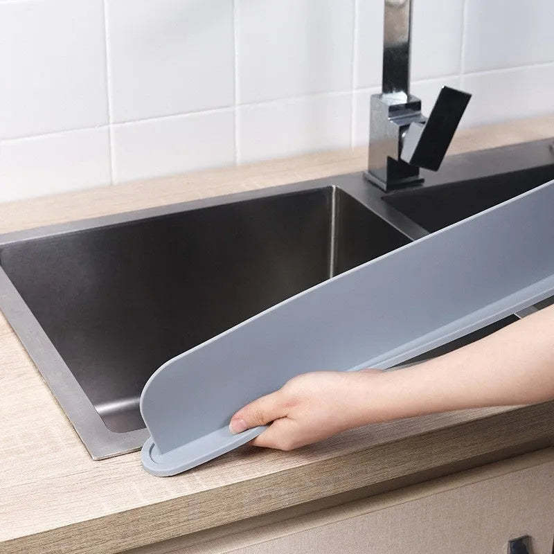 Silicone kitchen sink water blocking plate in three colour options: black, blue and grey