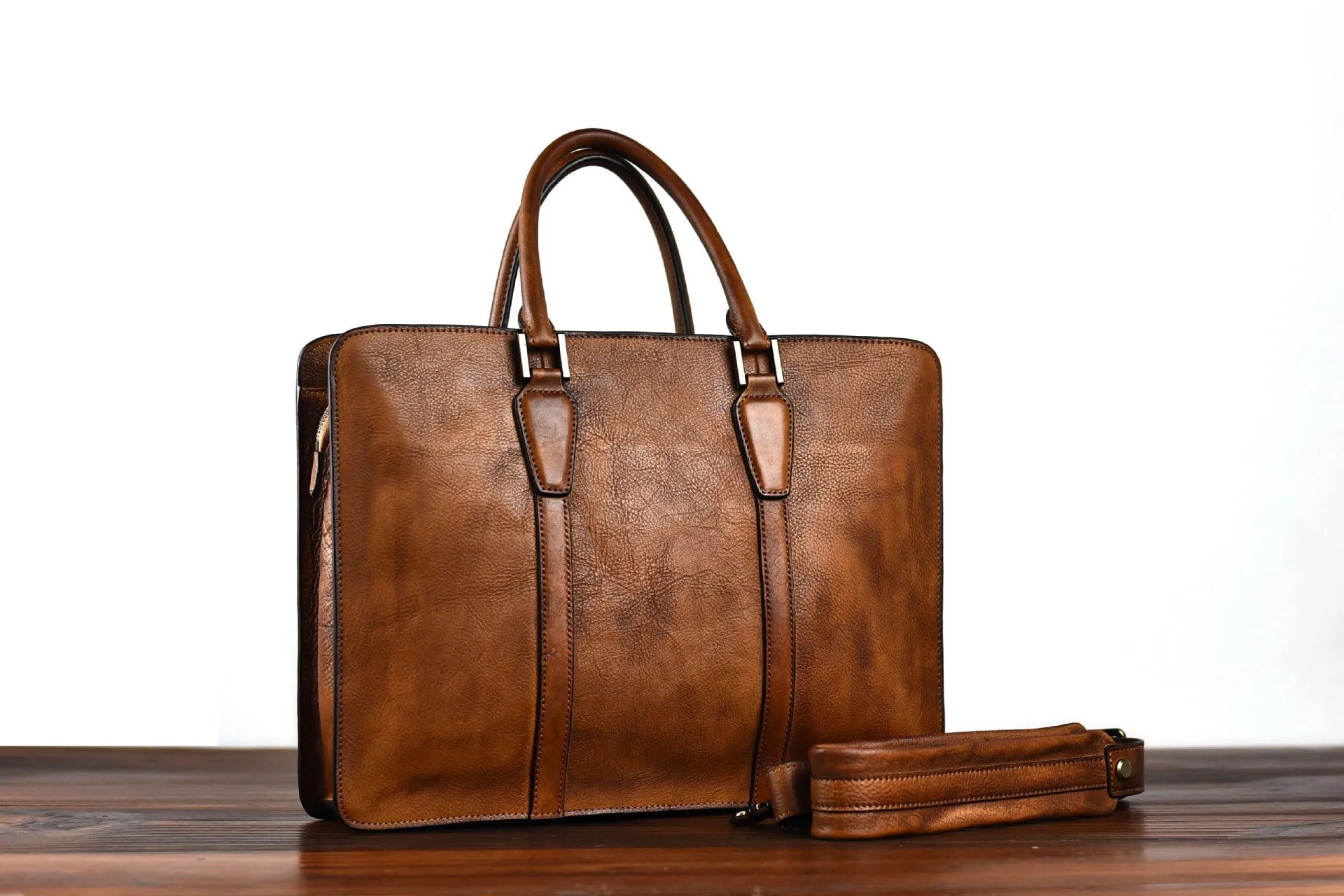 Men's black leather horizontal handbag with zipper opening showing 14-inch size.