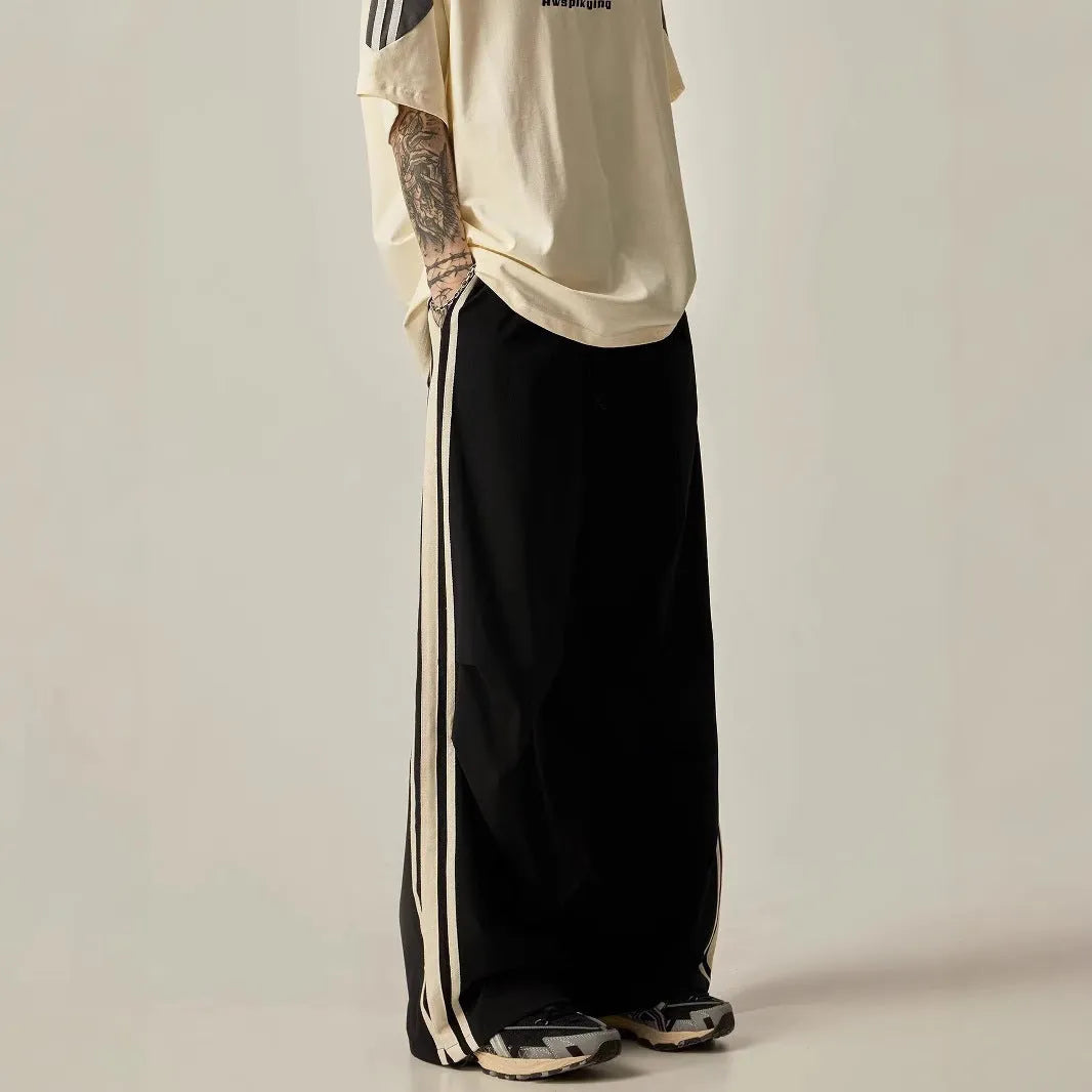 Black men's wide leg high-waist trousers with a straight-leg cut for summer casual wear.