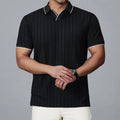 Man wearing a loose-fit black nylon polo shirt, short sleeves, casual style.