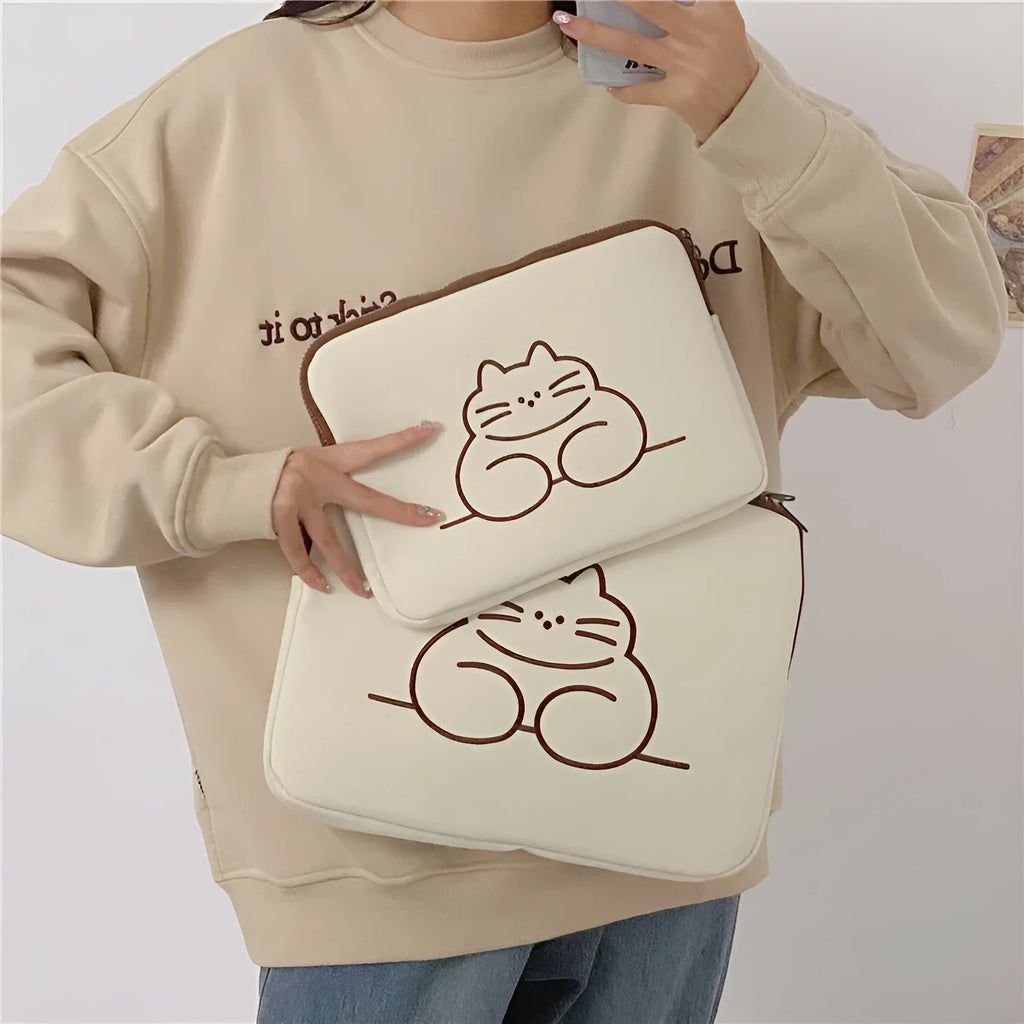Embroidered cat design on a nylon tablet protective sleeve with a zipper.