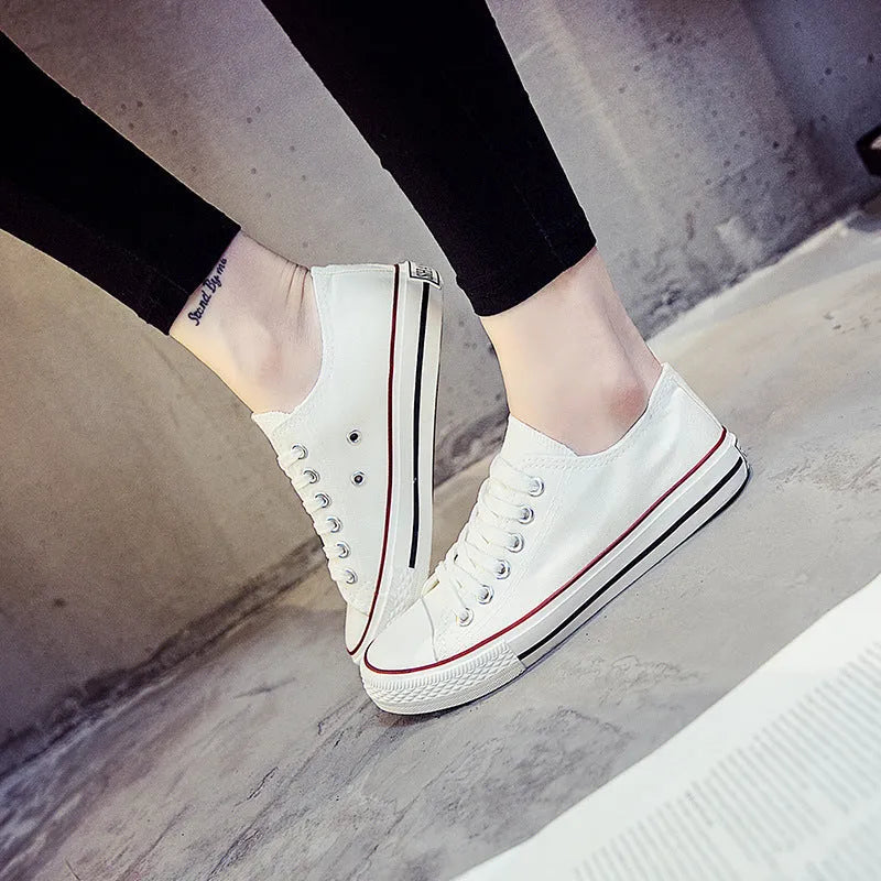 Women's solid colour canvas casual shoes shown in black, white black, white red, and all black.