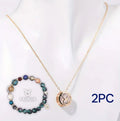 Natural stone beaded necklace and matching bracelet set on a grey background