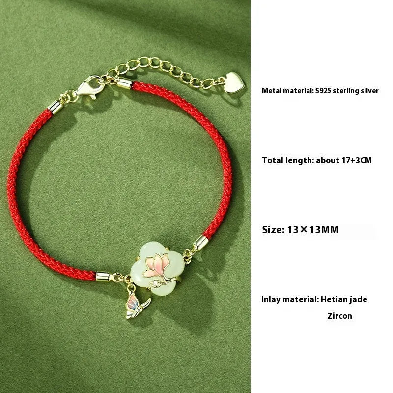 Magnolia flower jewellery set in sterling silver with inlaid green jade, showing necklace, bracelet, and stud earrings.