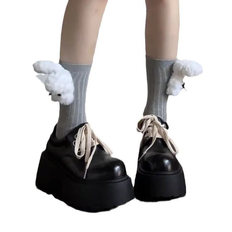 Matte black women's retro lace-up shoes with a thick sole and a muffin heel.