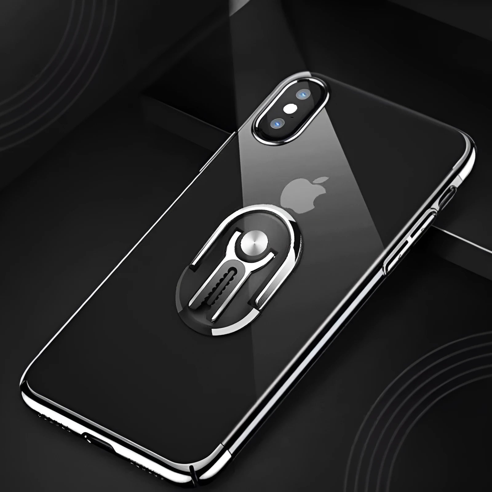 Black universal car phone bracket mounted on a car air vent, showing 360-degree rotation and flexible phone grip.