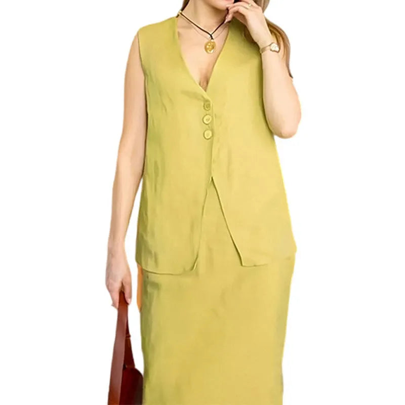 Women's white polyester two-piece set with sleeveless vest and long skirt on a hanger