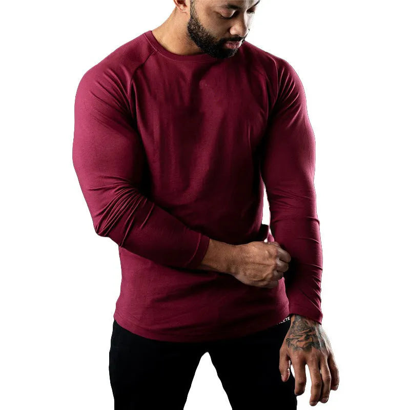 Men's tight-fitting long sleeve cotton sports t-shirt in multiple colours for exercise.