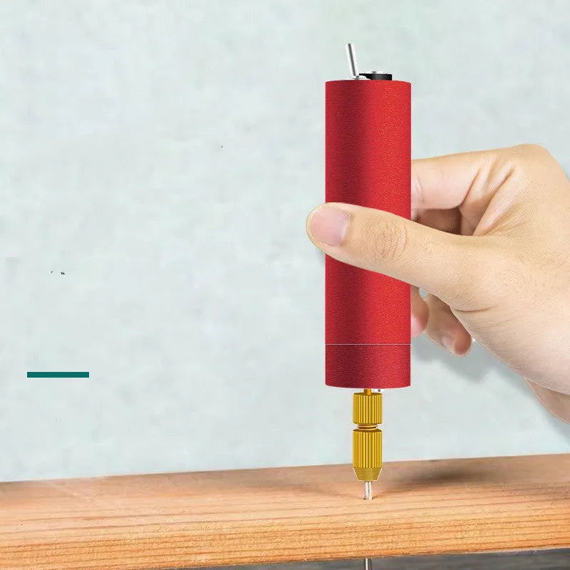 USB-powered aluminium alloy mini electric drill grinder with three drill bits and a wrench on a workbench.