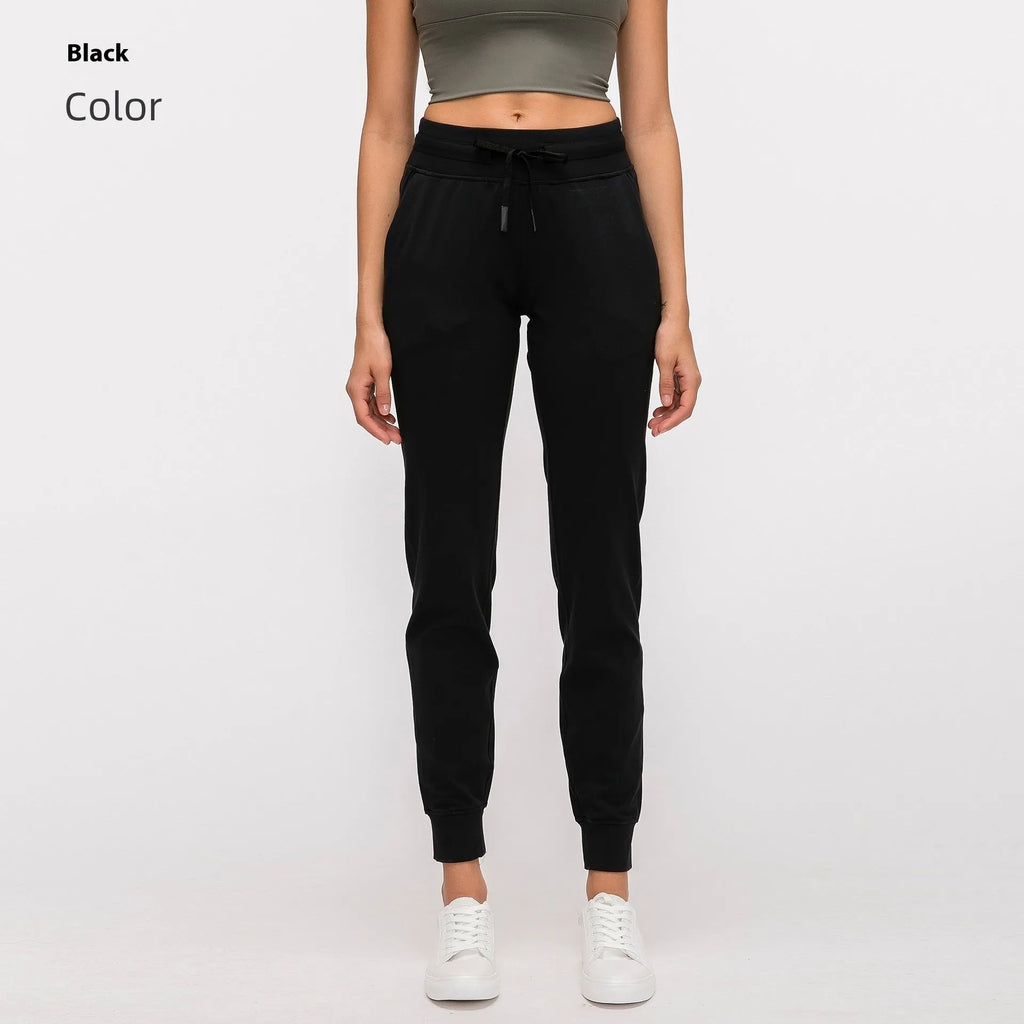 Women's high-waist yoga pants with a drawstring, shown in distilled coffee colour.