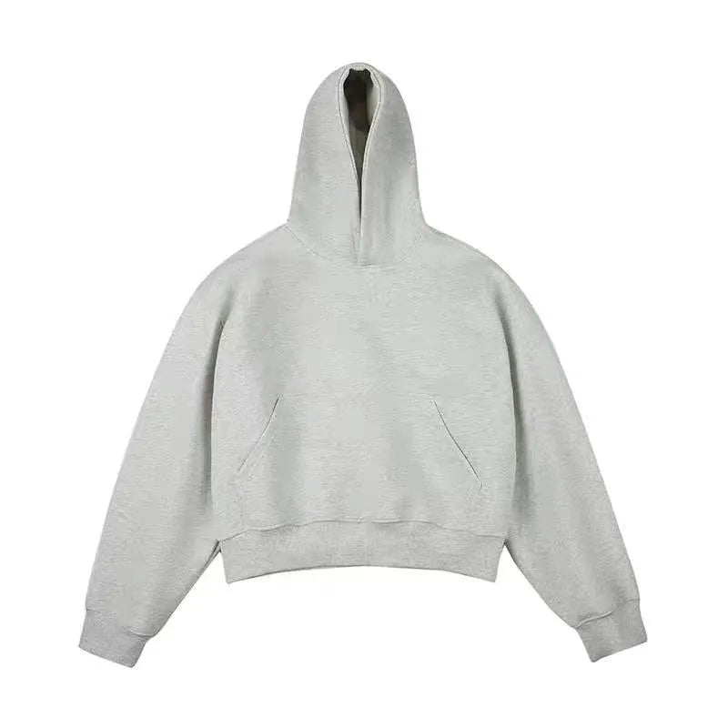Man wearing a dark grey Chinese cotton composite hooded sweater with a removable hood and long sleeves.
