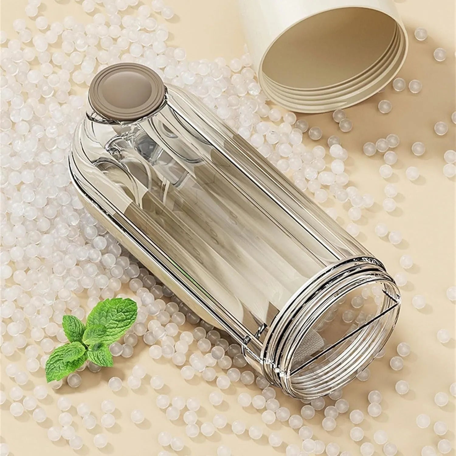 Foldable dog water bottle with food dispenser in beige or green colour for walking and hiking