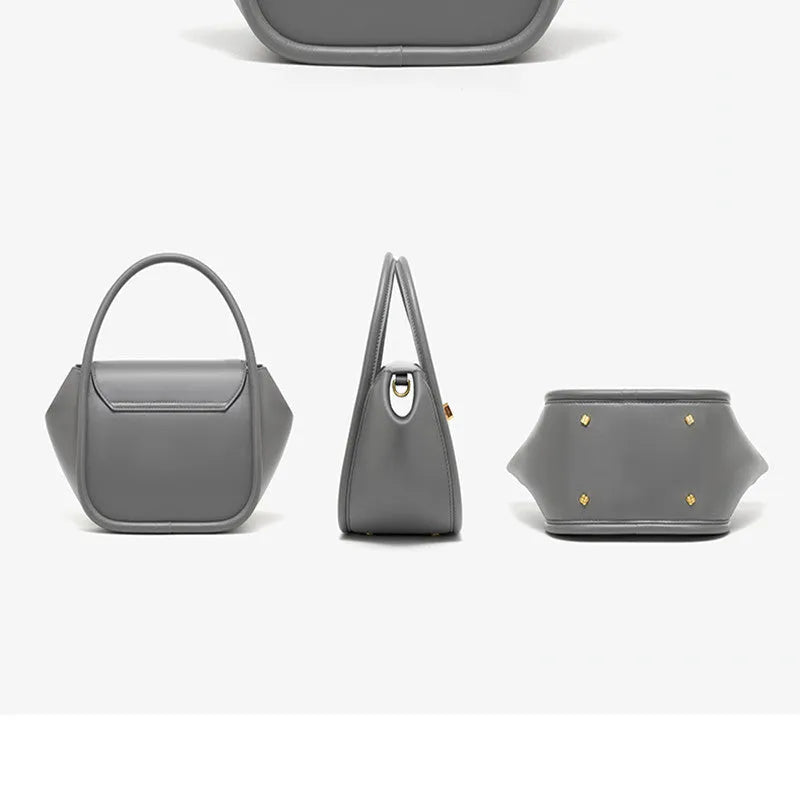 A wing-shaped cow leather women's tote bag with a cross-body strap and latch closure in a choice of colours.