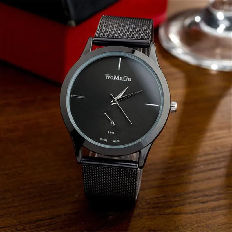 Unisex alloy mesh quartz watch with round silver case and dial on wrist