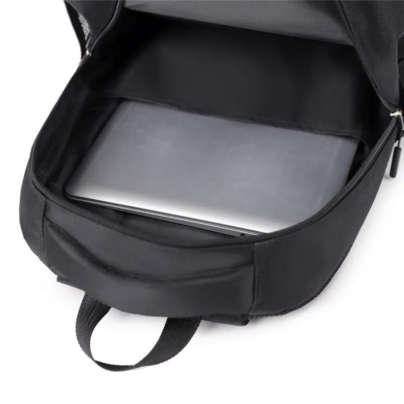 Casual men's Oxford cloth backpack in one of four colours: grey, black, green, or blue.