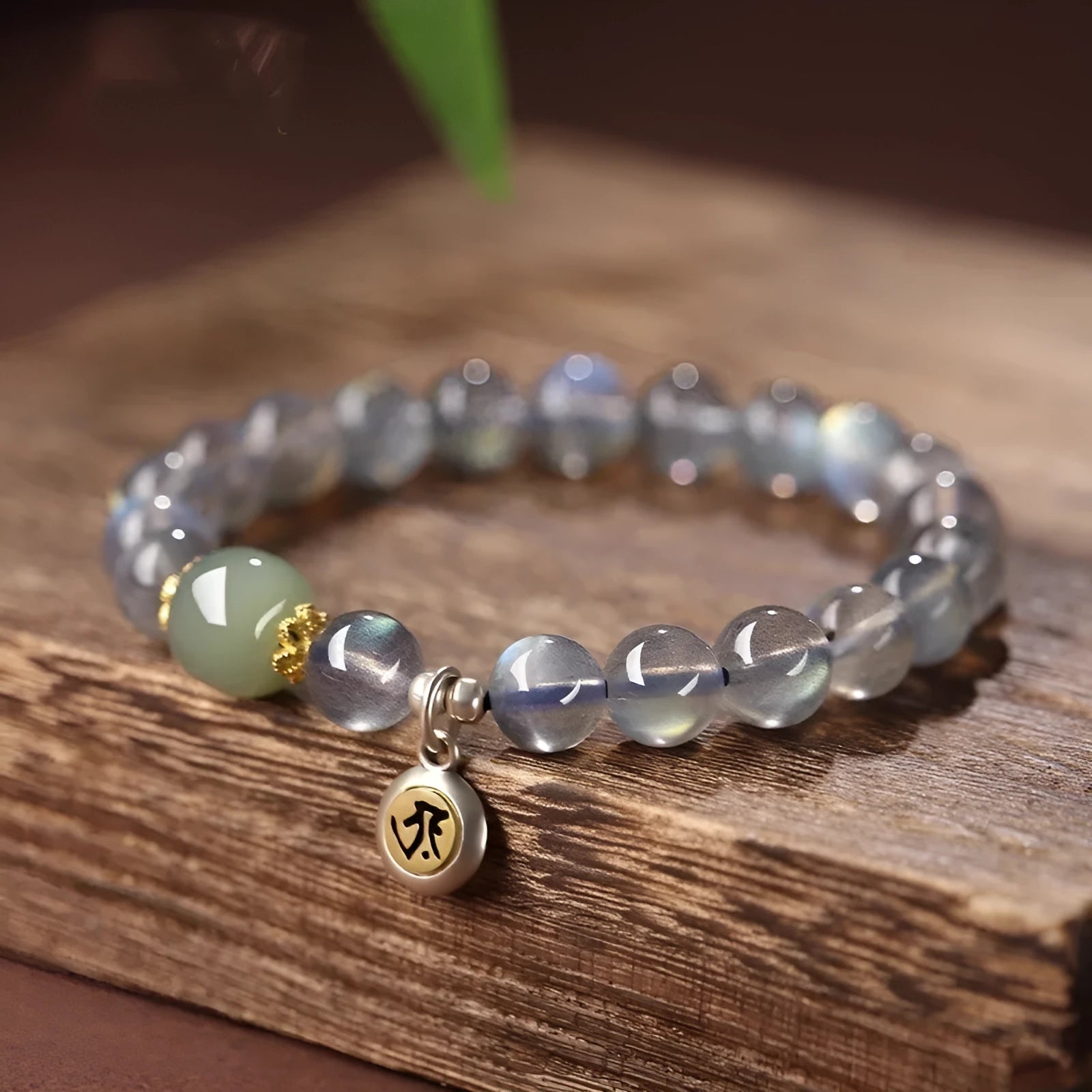 Moonstone Buddha beads bracelet with electroplated Guanyin mouse design on 8mm crystal bead