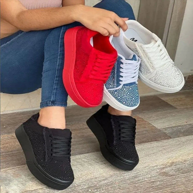 Plus size women's black lace-up casual sports shoes with rhinestone details and a thick flat rubber sole.