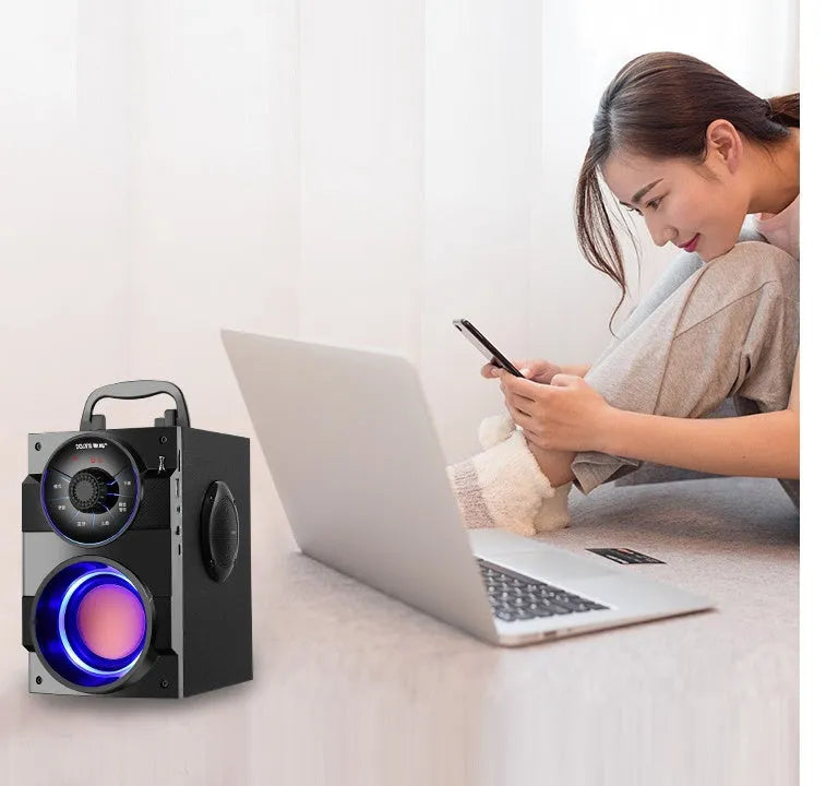 Black portable audio system with subwoofer and 3.5mm audio cable for connecting to phones and laptops
