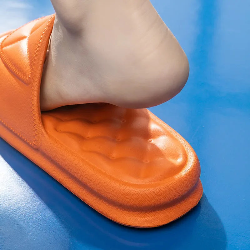 A pair of soft EVA couples bath sandals with a thicker sole, shown in a choice of colours on a bathroom floor.