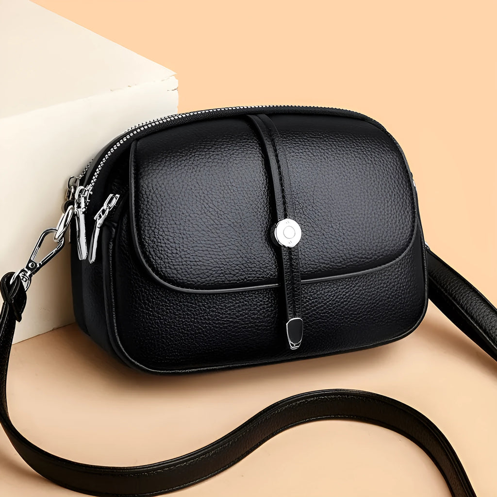 City Simple women's crossbody shoulder bag in soft PU leather with oval suitcase shape and sewing thread detailing