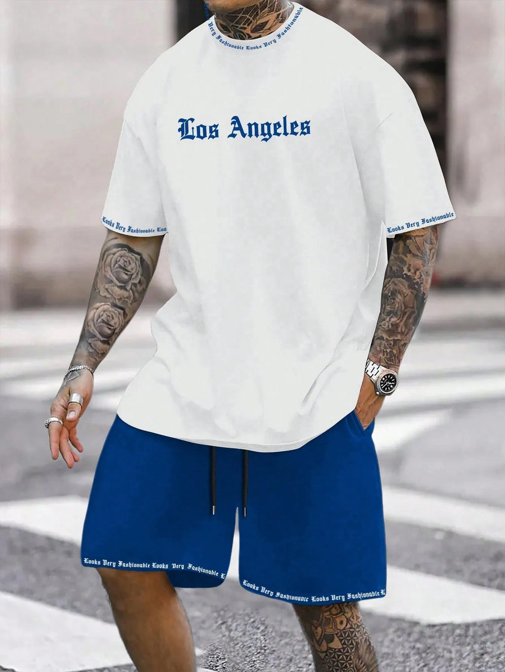 Men's blue printed short sleeve top and matching shorts sports set laid flat