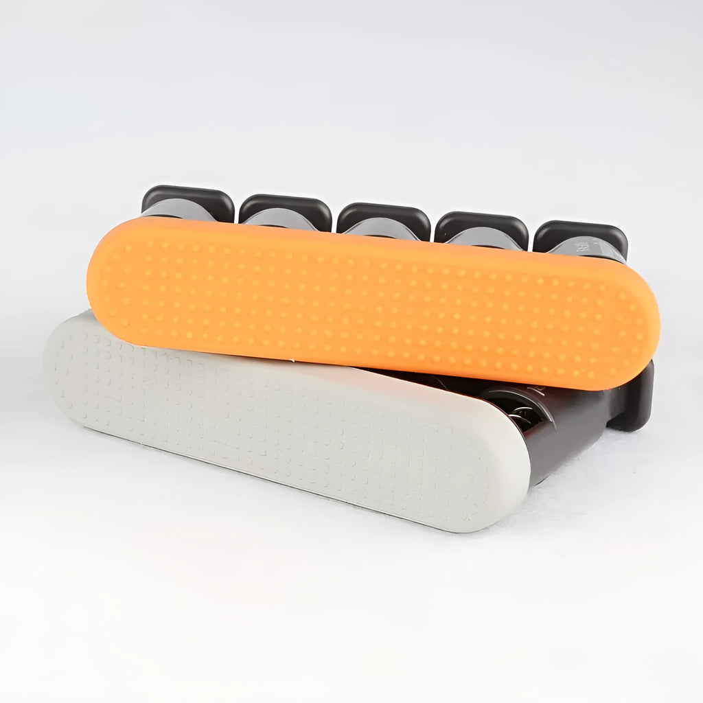 Grey and orange non-slip silicone finger trainer for guzheng, piano, and guitar hand muscle development.