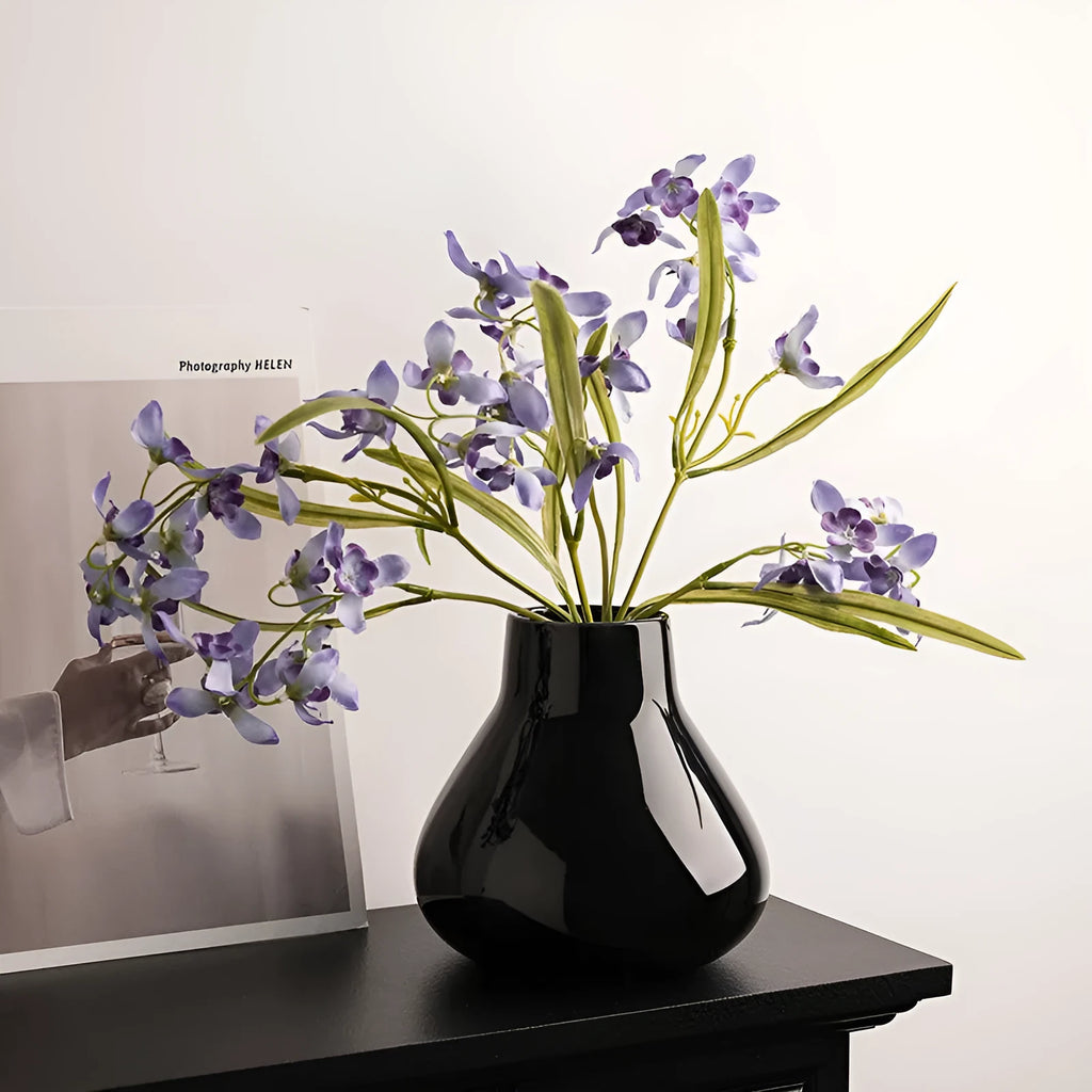 Ceramic vase with glass surface in black or white colour featuring coloured glaze finish and modern simple style