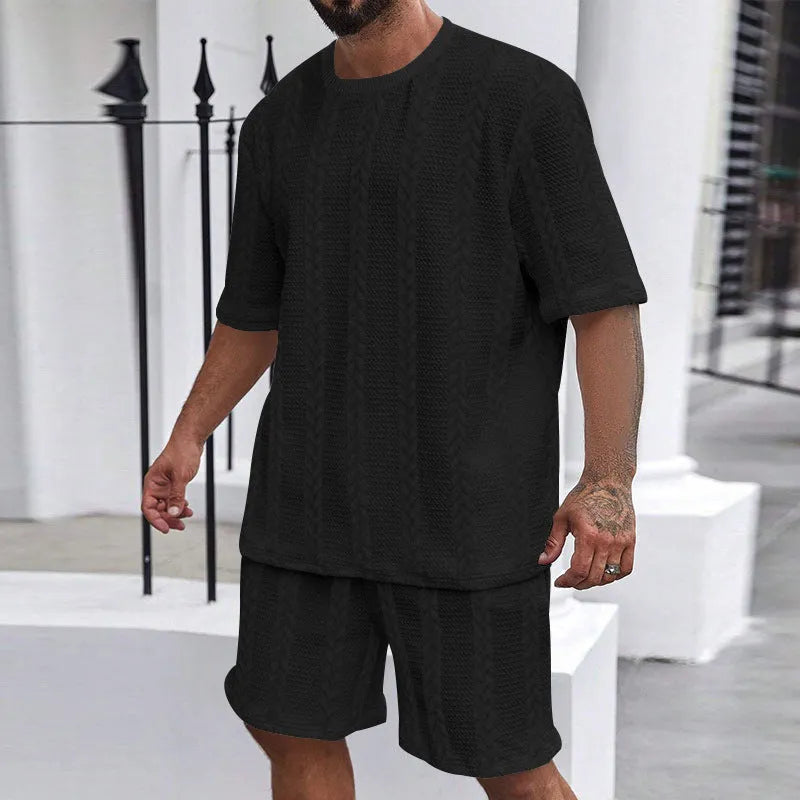 Knitted short sleeve pullover and matching shorts set in a solid colour with jacquard pattern.