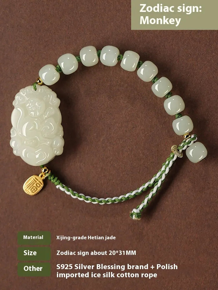 Hetian Jade Chinese zodiac bracelet on red cotton rope with S925 silver card for Year of Rabbit.