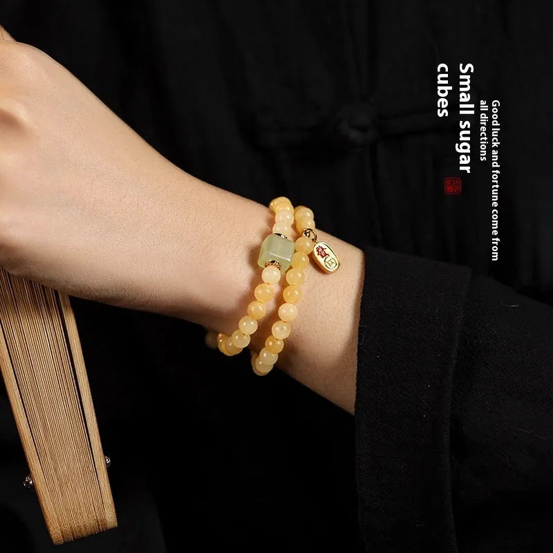 Hand-woven women's topaz bracelet with 6mm lucky barrel beads and square sugar jade beads in yellow jade colour