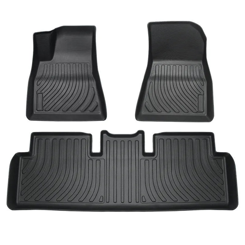 Heavy-duty rubber floor mats for Tesla cars with TPE footrest section.