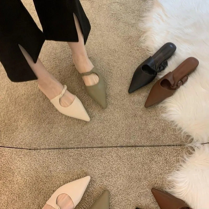 Women's semi-toe box slippers with leather lining and rubber sole in four colour options.