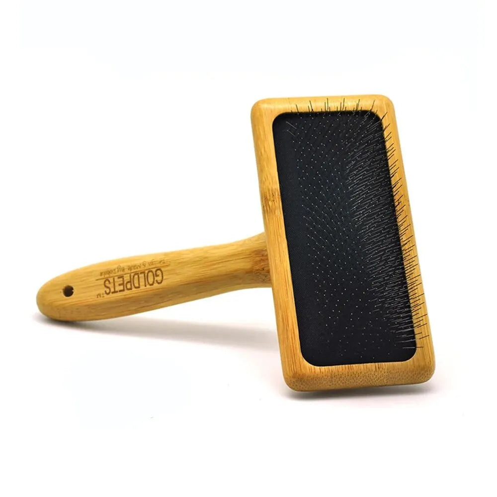 Goldpets bamboo wood slicker brush for pets with stainless steel pins on a wooden handle.