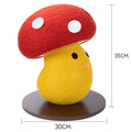 Foldable mushroom-shaped cardboard cat scratcher board on a carpet next to a sofa.