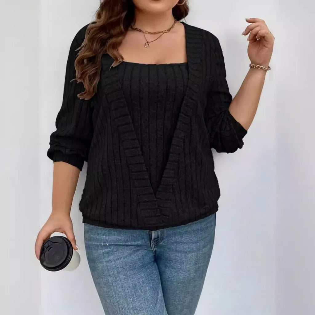 Women's solid colour ribbed false two-piece suit dress with V-neck and long sleeves.