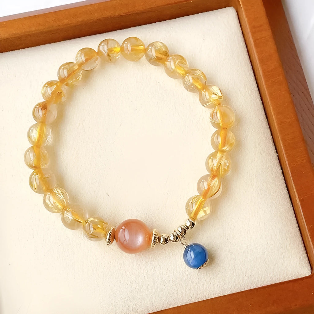 Women's gold rutilated quartz sunstone crystal bracelet with diamond-shaped beads