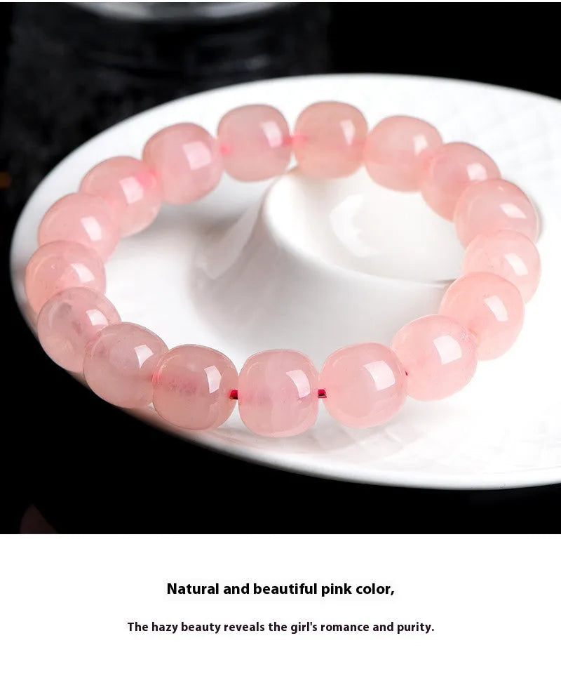 Natural pink crystal bracelet with geometric barrel-shaped beads measuring 8-10mm