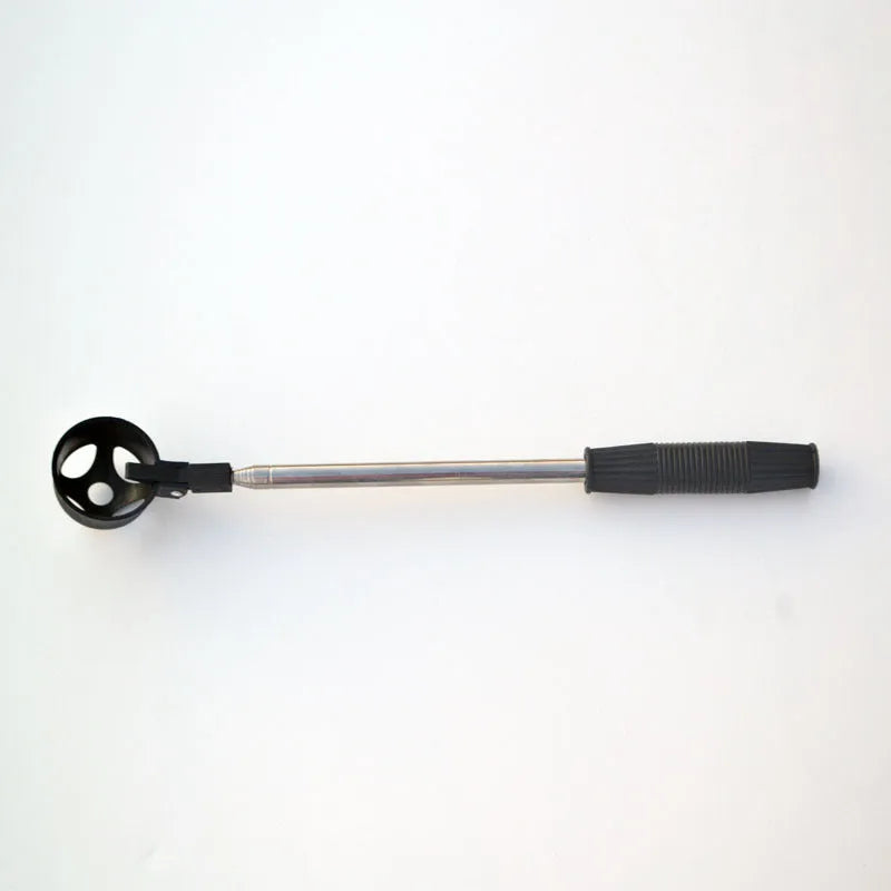 Black stainless steel retractable golf ball retriever with plastic head on golf course