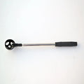 Black stainless steel retractable golf ball retriever with plastic head on golf course