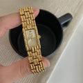 Women's mid-ancient bracelet watch with a 15mm silver dial and stainless steel strap.