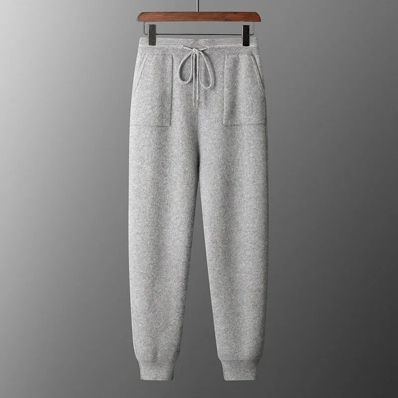 Men's light grey hooded knitted sweatshirt and matching long trousers casual set.