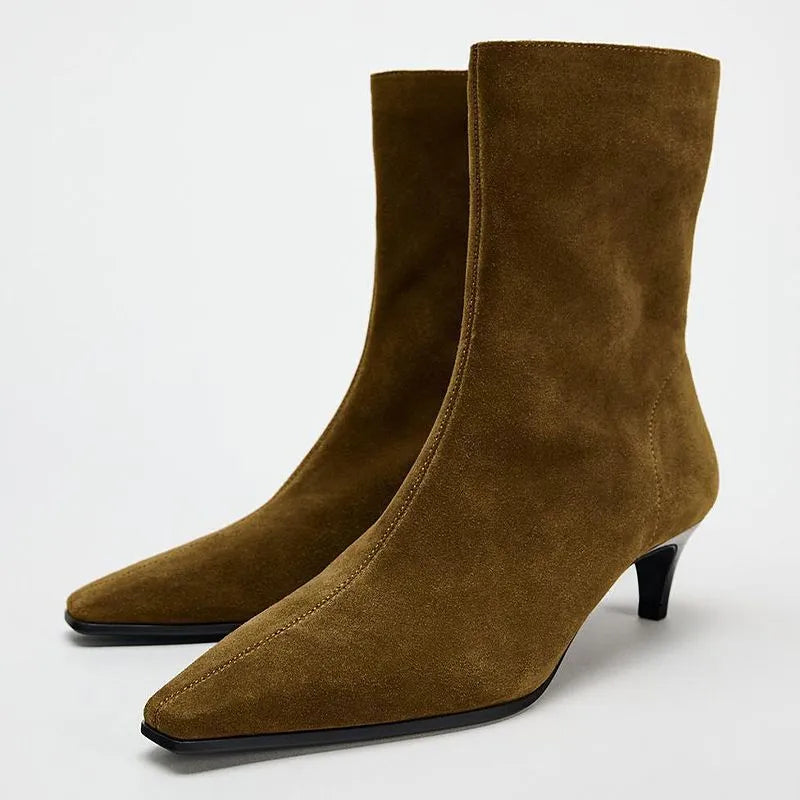 Brown square toe retro ankle boots with a side zip and a kitten heel on a waterproof platform sole.