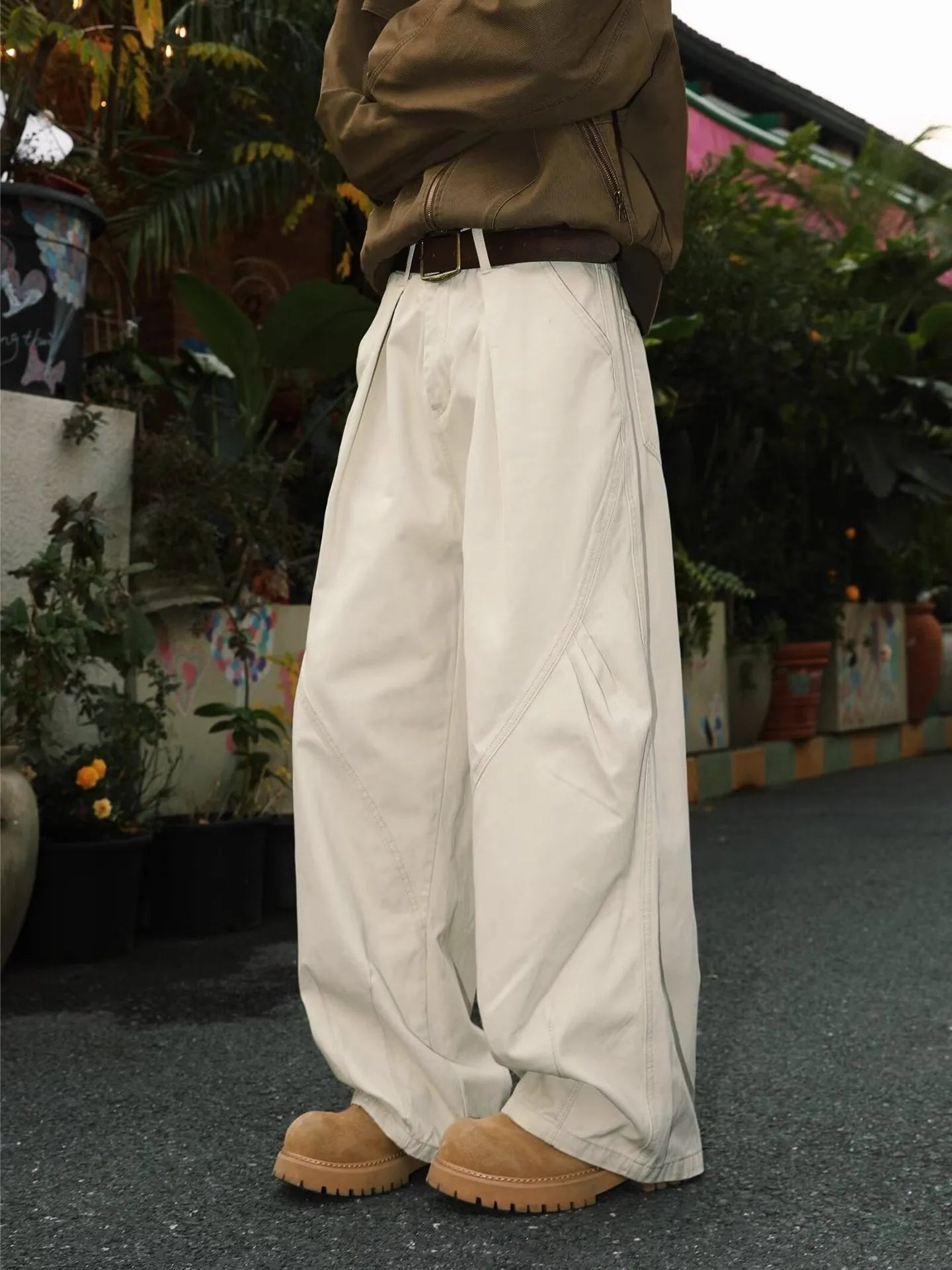 Men's straight-leg pleated trousers in black, brown, and apricot colours with mid-waist design