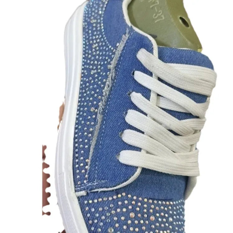 Plus size women's black lace-up casual sports shoes with rhinestone details and a thick flat rubber sole.