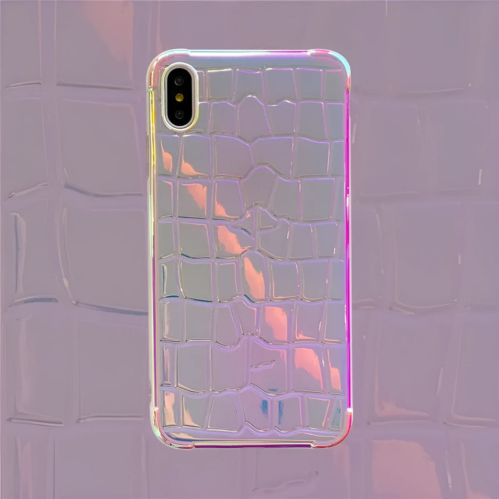 Silver glossy laser design silicone case for iPhone on a table.